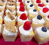 Rows of small cups of dessert samples